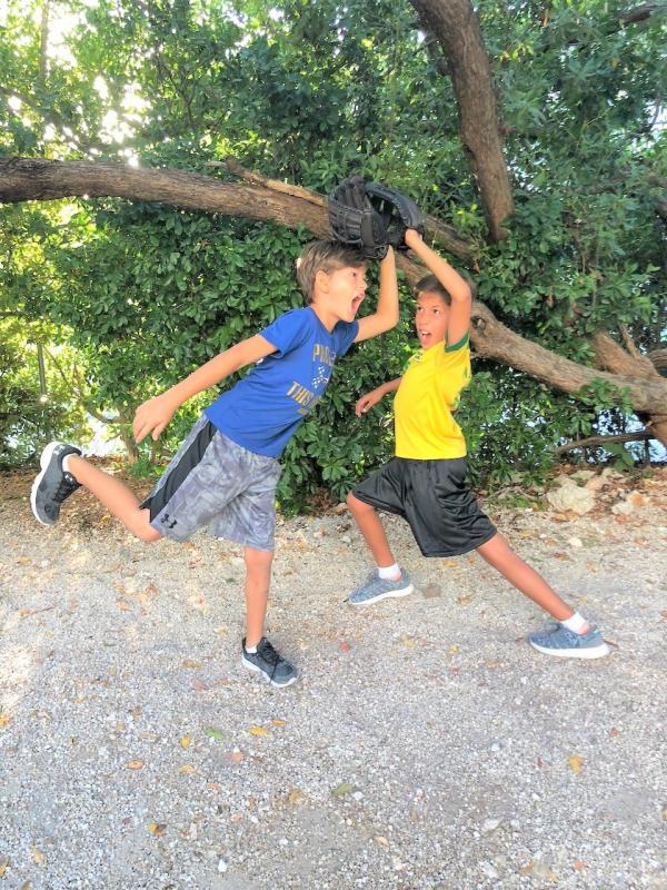 Ocean Studies Charter School students get creative with the use of baseball mitts during PE.